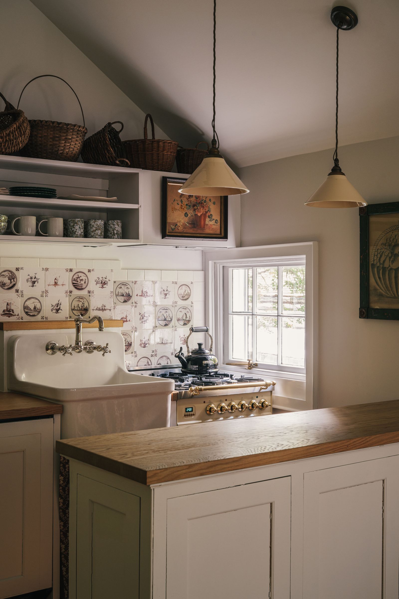 Image may contain Sink Sink Faucet Accessories Bag Handbag Indoors Kitchen Interior Design Lamp and Window