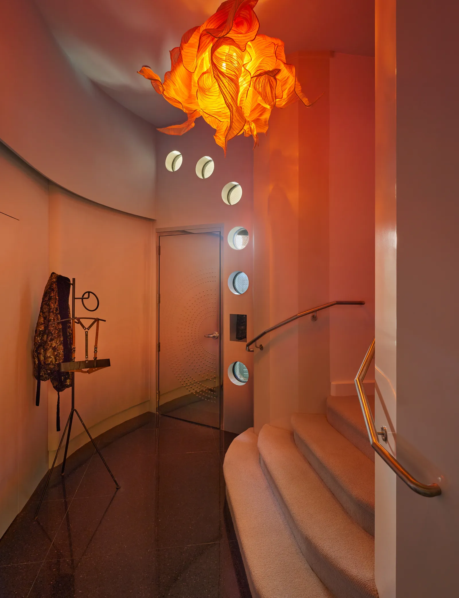Image may contain Lamp Chandelier Lighting and Indoors