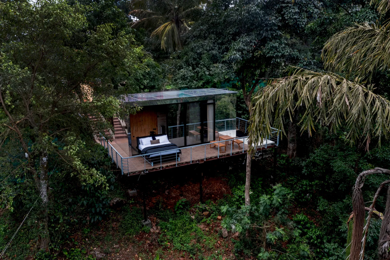 Image may contain Land Nature Outdoors Plant Rainforest Tree Vegetation Architecture Building Hotel and Resort